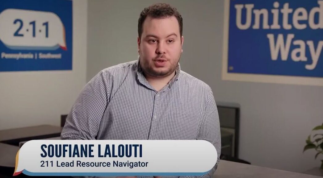 Soufiani Lalouti, the 211 Lead Resource Navigator and United Way and 211 posters.